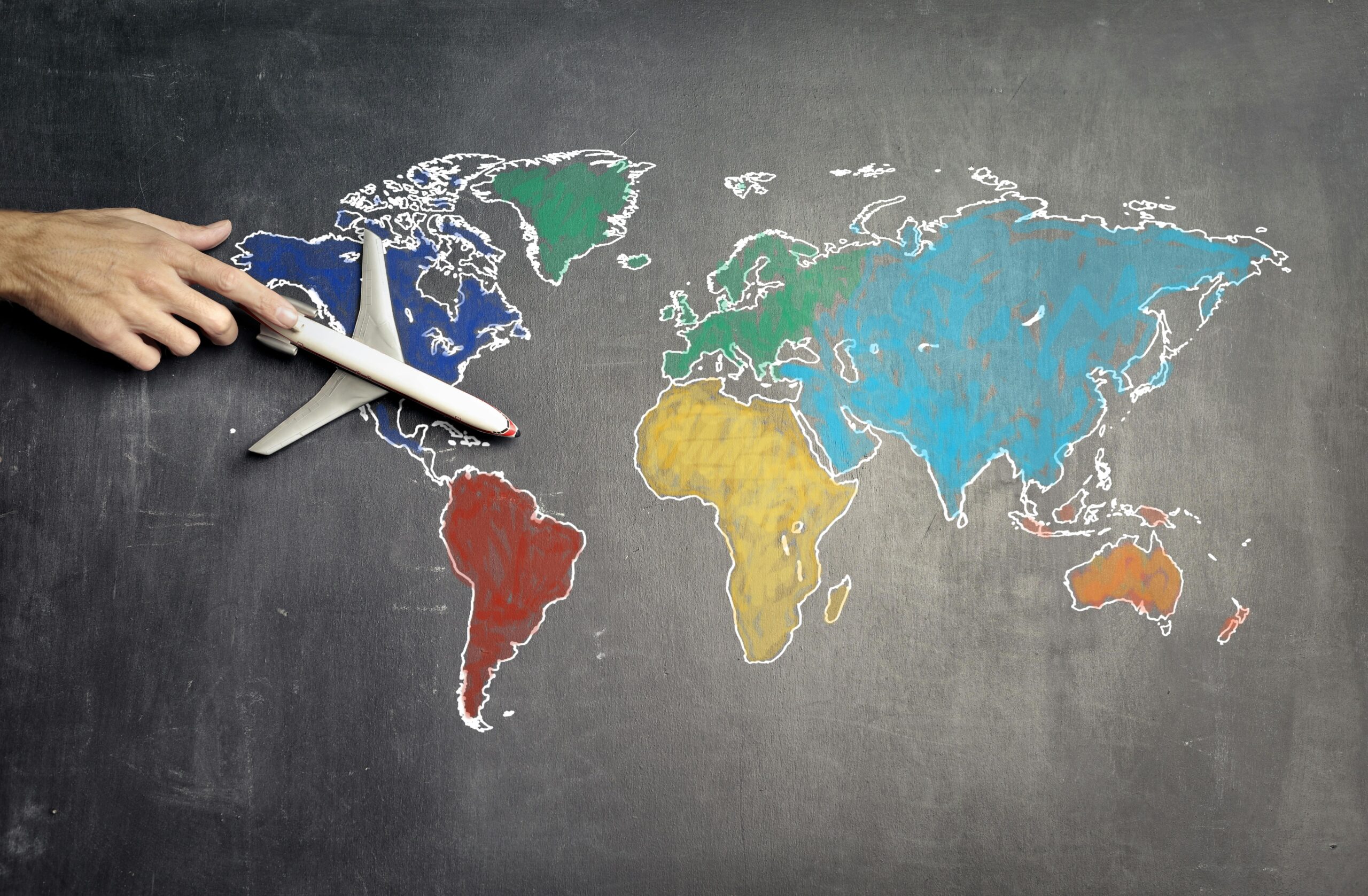 Plane figurine on world map